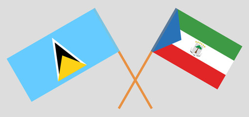 Crossed flags of Saint Lucia and Equatorial Guinea. Official colors. Correct proportion