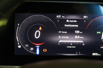 Digital speedometer and fuel economy display in a new vehicle gauge cluster 
