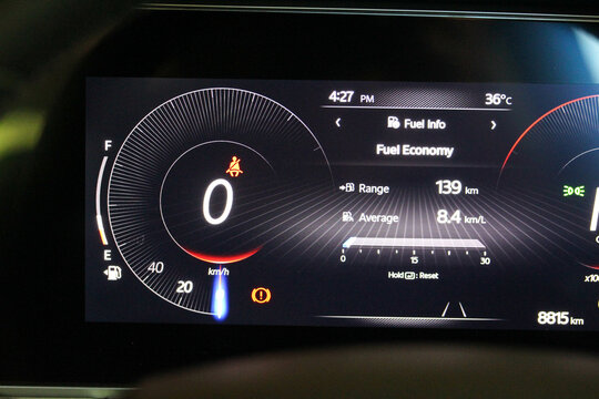 Digital speedometer and fuel economy display in a new vehicle gauge cluster - Powered by Adobe