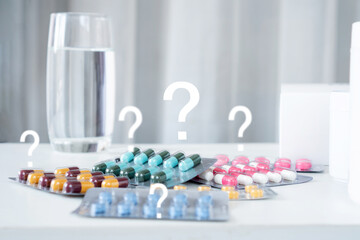using medicine incorrectly or taking wrong dose of antibiotics medicine concept with pills and a...