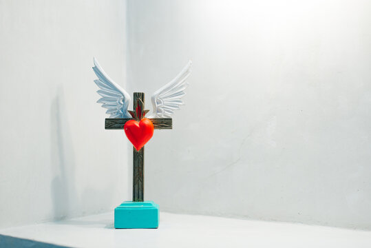 stand cross with a heart. home decoration