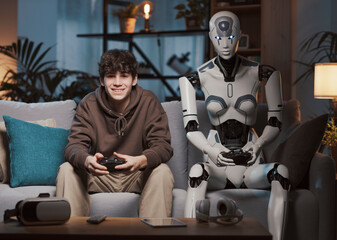 Happy teenager and AI robot playing video games together