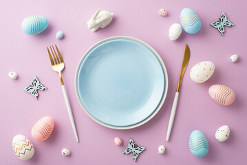 Easter concept. Top view photo of empty blue plate knife fork pink white blue eggs ceramic easter bunny and butterflies on isolated pastel purple background with copyspace