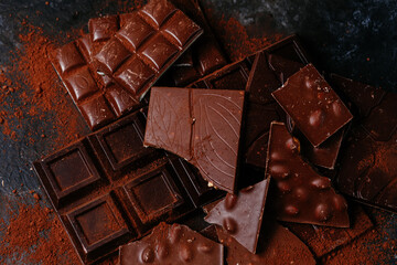 black and milk chocolate bars on a dark background
