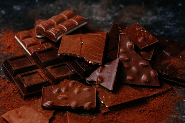 black and milk chocolate bars on a dark background