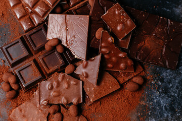 black and milk chocolate bars on a dark background