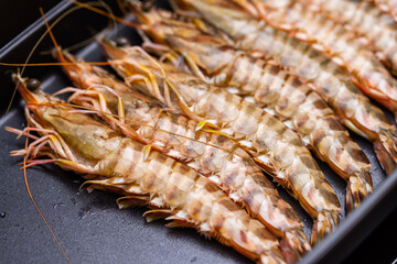 Fresh raw shrimp on grill pan