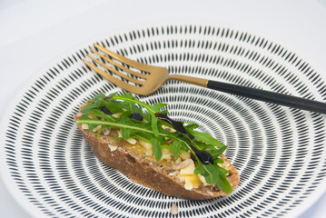 Italian style snack with rucola and cheese.