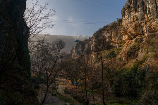 Tokatli canyon with far view of Crystal Glass Terrace (Kristal Cam Teras in Turkish) in a foggy day. Safranbolu, Karabuk, Turkey