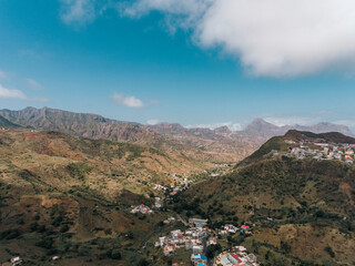 Aerial photos of Assomada in Santiago Island, Cabo Verde, reveal the vibrant culture, colorful markets, and stunning mountain landscapes of this historic town. The bird's-eye view captures the essence