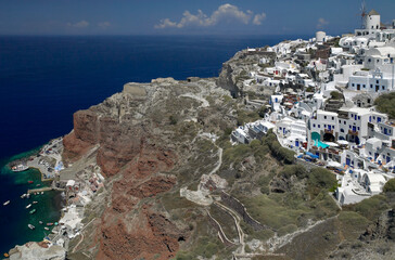 Fototapeta na wymiar The town of Oia on the clifftop above the volcanic caldera on the Greek volcanic island of Santorini (Thira) in the southern Aegean Sea.