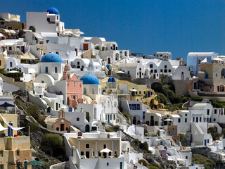 The town of Oia on the clifftop above the volcanic caldera on the Greek volcanic island of Santorini (Thira) in the southern Aegean Sea.