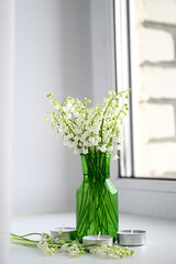 Composition of lily of the valley. Spring concept. A gift to a woman.