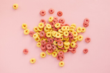Corn rings in glaze for breakfast on yellow background