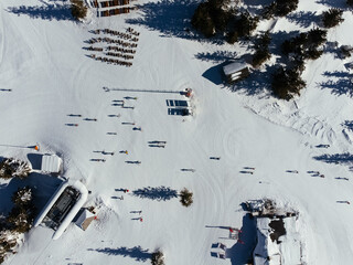 Winter sports: top view of people skiing in a ski resort in Kopaonic, Serbia