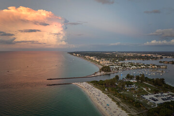 Nokomis beach with soft white sand and North and South Jetty in Sarasota county, USA. Many people...