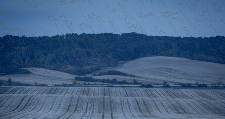 Image of mathematical equations over landscape