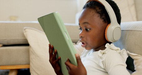 Language learning, headphones and black child with tablet for online education translation website or video call. Relax kid with digital technology listening and speaking for online learning games