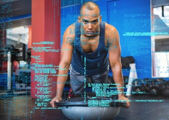 Data processing against african american fit man working out at the gym