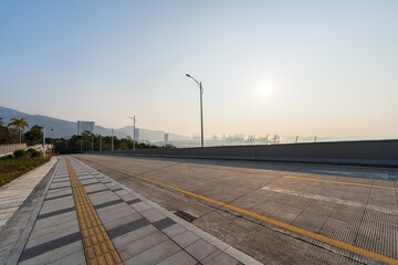 road in city during sunrise