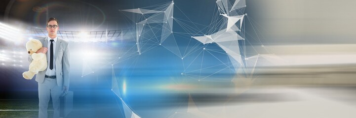 Blurred effect with copy space against caucasian businessman holding a teddy bear