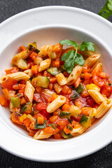 fresh pasta salad tomato, cucumber, corn, vegetable, penne pasta meal food snack on the table copy space food background rustic top view 