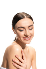 satisfied young woman with bare shoulders looking down isolated on white. © LIGHTFIELD STUDIOS