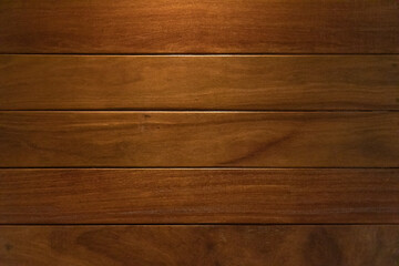 Wood wall texture under downlight provides rich color background texture