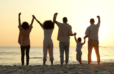 Fototapeta na wymiar Sunset, holding hands and cheering with family at beach for happy, freedom and relax on vacation. Travel, holiday trip and summer break with parents and children for care, support and solidarity