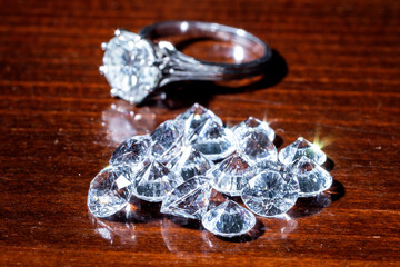 pile of diamonds with a 3 karat white gold and diamond ring