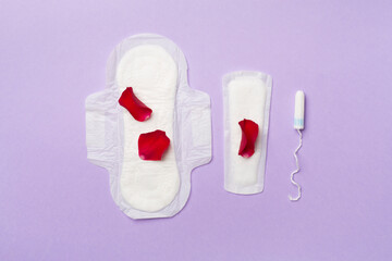 Menstruation hygiene products on color background, top view