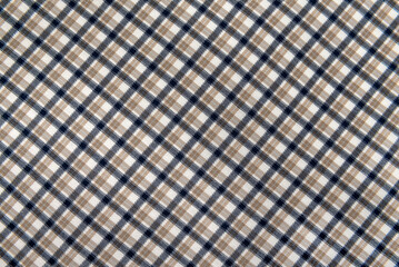 Plaid material. Texture or background of checkered fabric. Canvas. pattern