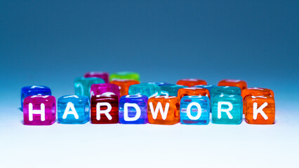 word "hard work" on colorful cubes. fun concept about working hard. inscription on the cubes