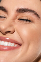 close up of positive young woman with flawless and natural makeup.