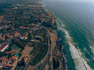 Aerial photos of Azenhas do Mar in Sintra, Portugal showcase a picturesque seaside village with...