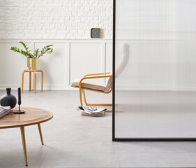 Rocker chair in the white room, brick and classic wall background, chamber, green plant leaf close...