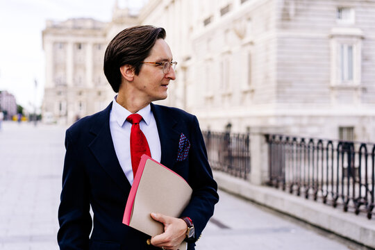 Entrepreneur with folder on street