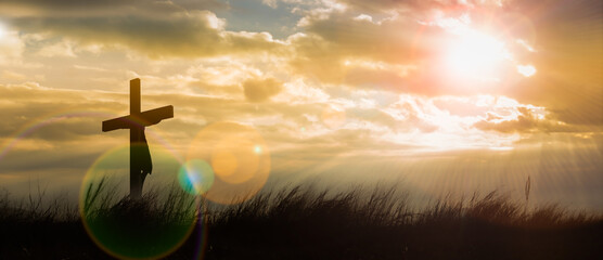 Silhouette of Jesus with Cross over calvary sunset,holy cross symbolizing the suffering,death and...