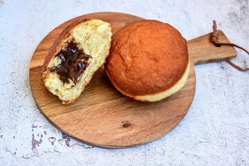 Delicious home made Donuts with Chocolate Filling covered with  icing sugar