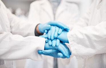 Doctor, team and hands together with gloves in healthcare, partnership or trust for collaboration, unity or support at lab. Group of medical experts piling hand in teamwork for motivation or safety