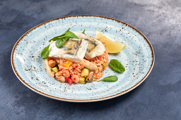 white fish with rice and vegetables