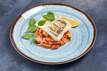 white fish with rice and vegetables