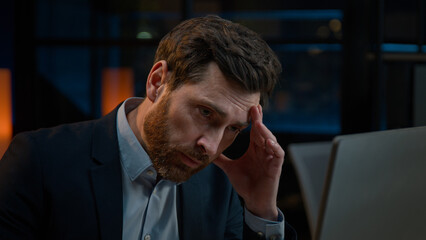 Caucasian exhausted businessman man overloaded evening computer work in office sick ill worker...