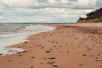 Landscape of Latvian natural scenery, Baltic Sea and sandy beach, steep banks