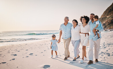 Family, grandparents and children walking on beach for holiday, vacation and bonding on weekend...