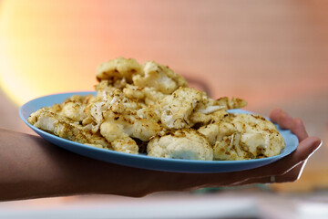 Roasted cauliflower steak. Vegetable meat substitute. Tasty vegetarian food. Selective focus