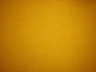 Yellow velvet fabric texture used as background. Empty yellow fabric background of soft and smooth textile material. There is space for text...