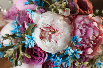 wedding bouquet and gold ring
