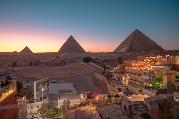 Beautiful View of The Great Pyramids of Giza at Sunset - obrazy, fototapety, plakaty