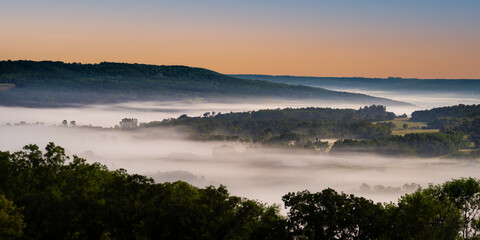Valley filled with fog at moon light